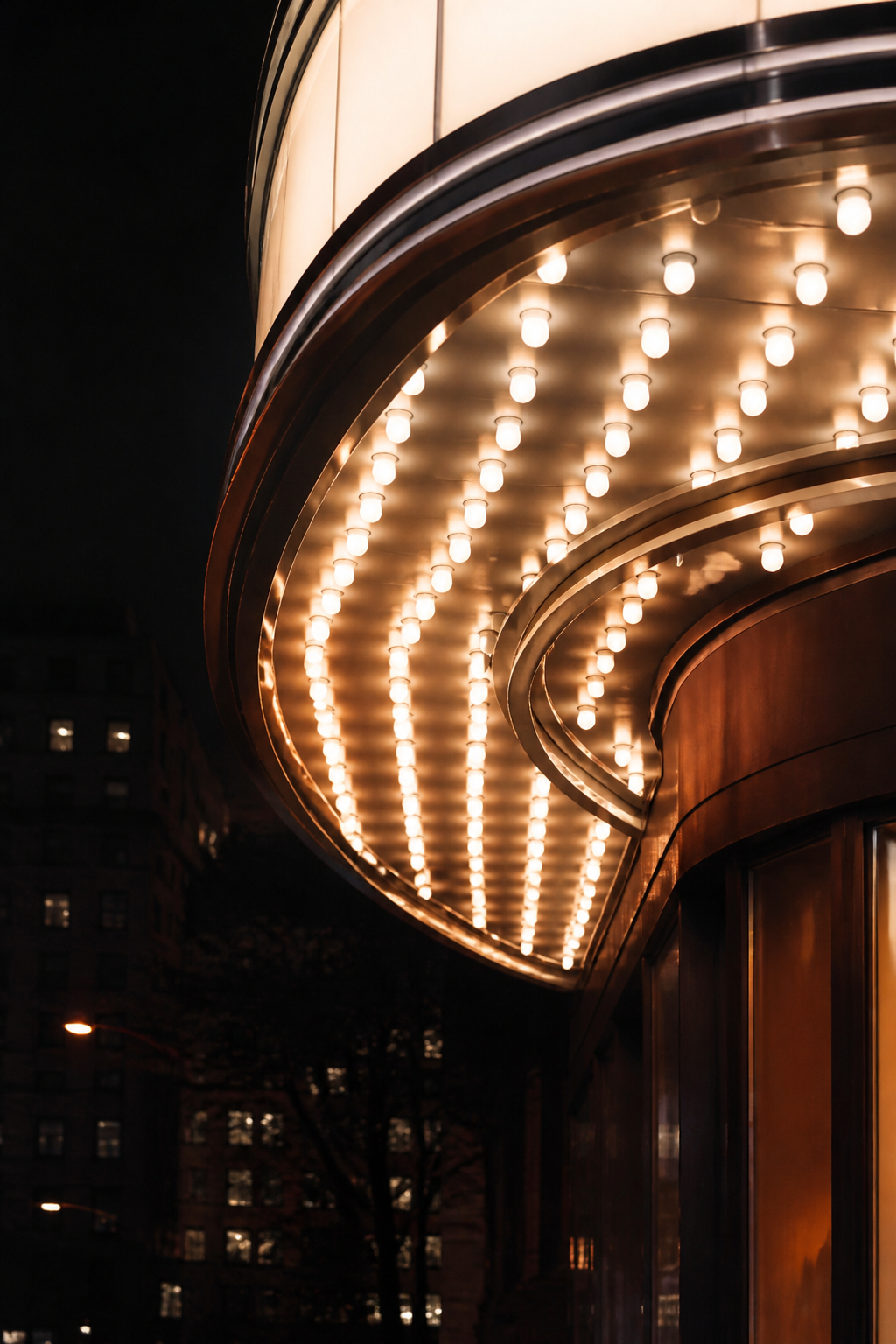 Illuminated modern cinema marquee lights photographed at night